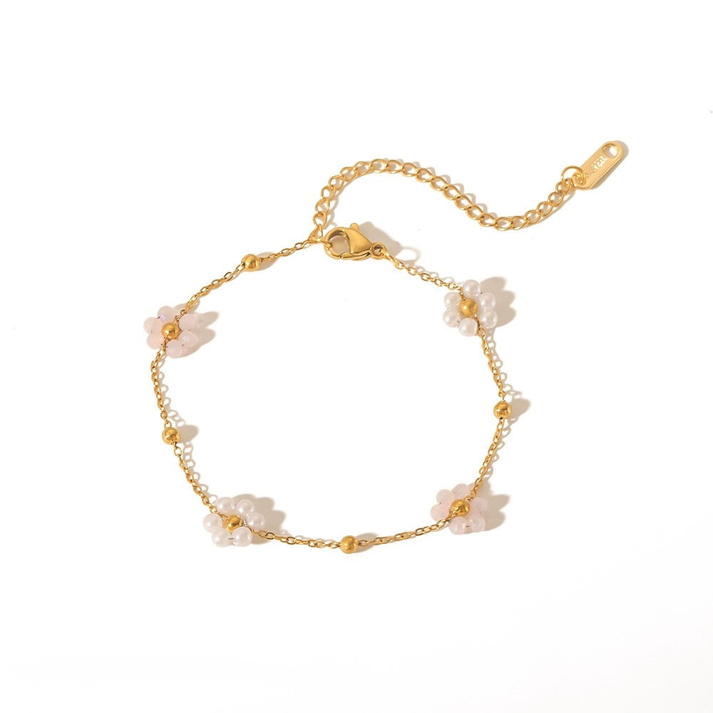 14k gold-plated sterling gold  bracelet with pearl flower details.